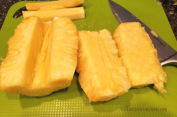 Core is cut out of the fresh pineapple.