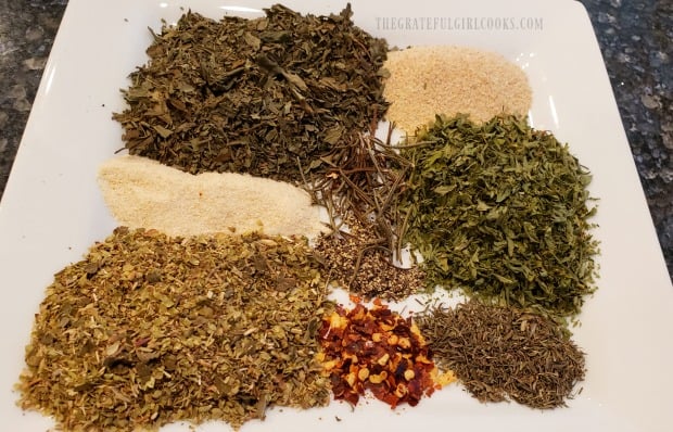 The spices used to make Italian seasoning mix, on a plate.