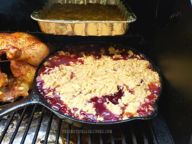 The peach pear blueberry cobbler is bubbly and golden brown on top when done.