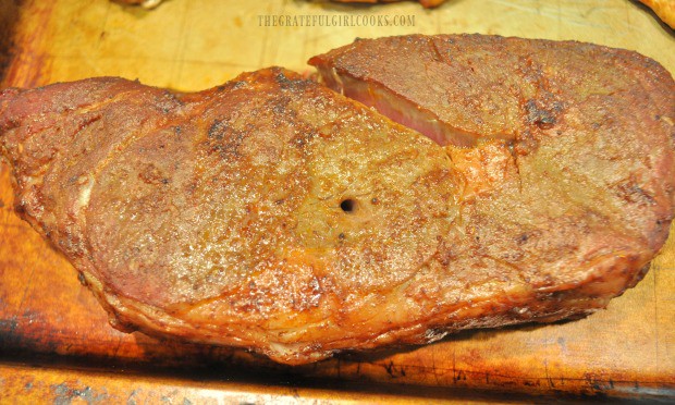 The smoked chili rib eye steaks are removed to rest while grill is turned up to high grilling temp.