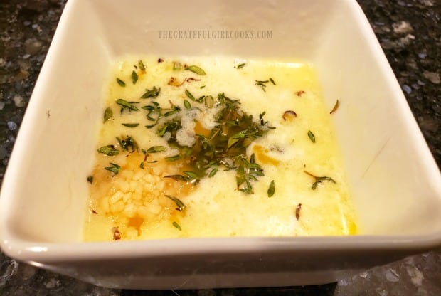 Melted butter, garlic and thyme are combined to make the simple sauce for the meat.