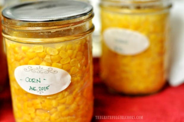 Label the cooled jars, and remove screwbands before storing home canned corn.