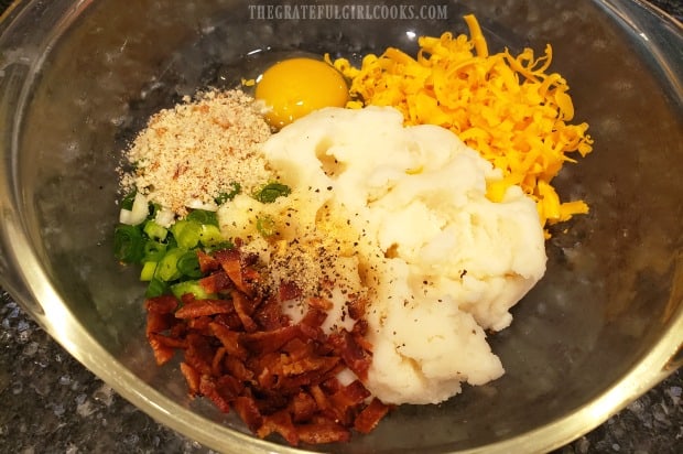 Bacon, cheese, onion, egg,bread crumbs and mashed potatoes ready to make fritters.