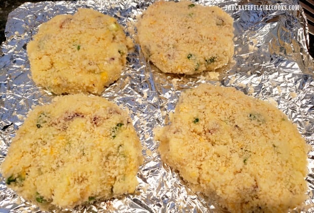 Four mashed potato loaded fritters ready to be fried.