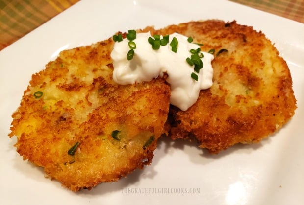 Dollop the mashed potato loaded fritters with sour cream and chopped chives to serve.