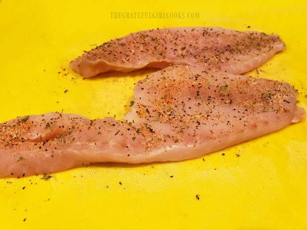 Each of the fish fillets are seasoned on one side before cooking.