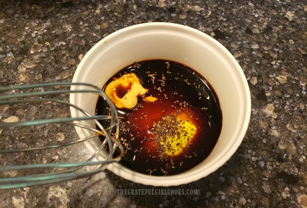 Ingredients for balsamic dressing in small bowl.