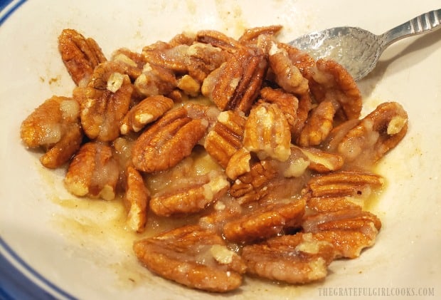 When the pecans are fully coated, it is time to bake them!