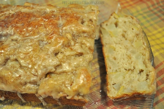 A slice of pear bread is cut and is ready to enjoy.