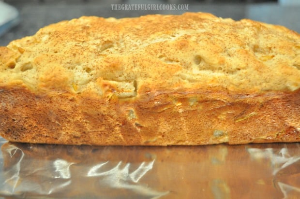 The bread cools (out of the pan) for several minutes before being glazed.