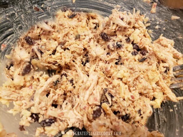 Shredded chicken, beans, cheese, sour cream and seasonings are mixed together for chimichangas.