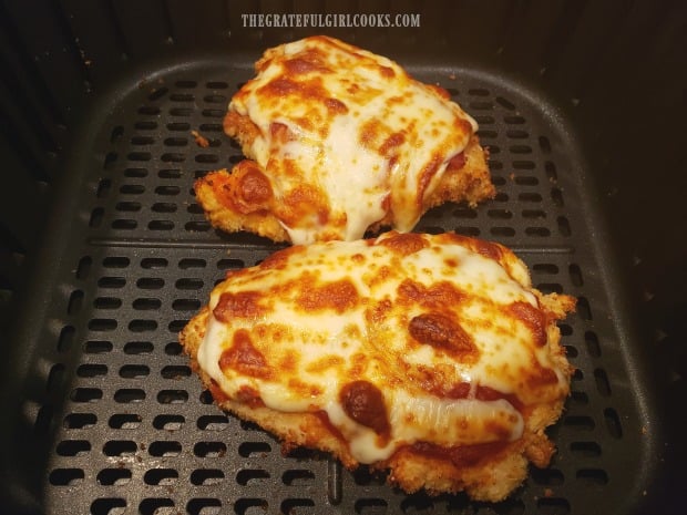 The cheese has melted over the air fryer cooked chicken parmesan, and is ready to serve!