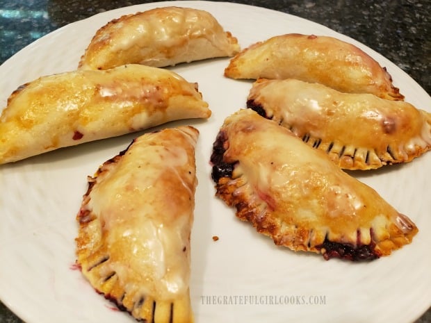 The blackberry handpies are brushed with the glaze, and then are ready to eat!