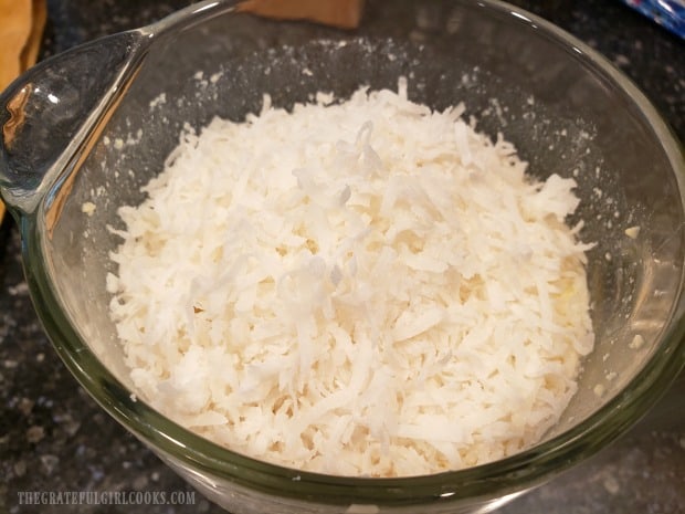 Shredded coconut is added to pie filling ingredients in blender.