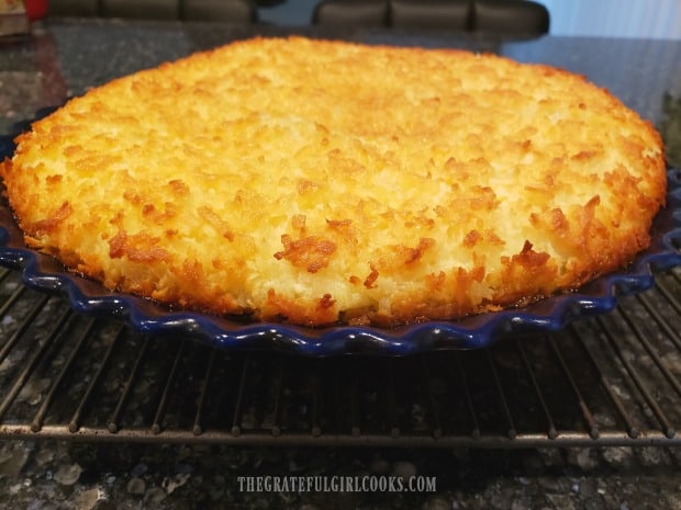 The coconut chocolate chip pie has finished baking and cools on wire rack.