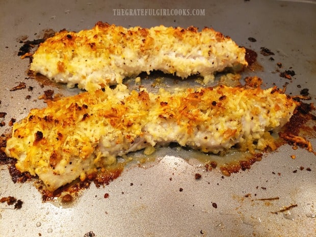 When done baking, garlic parmesan rockfish are golden brown and flaky.