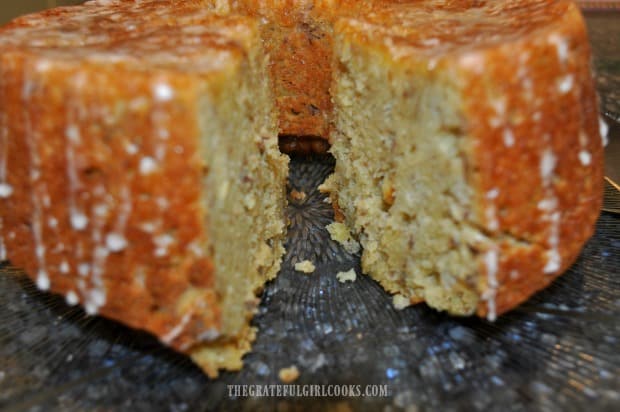 A close up peek at the inside of the pound cake, with a slice removed.
