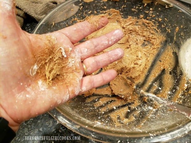 Dough is shaped into balls in the palm of your hands, leaving them a bit messy! 