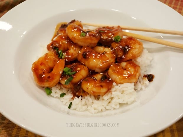 Once heated through, simple Szechuan shrimp dish is served on top of rice.