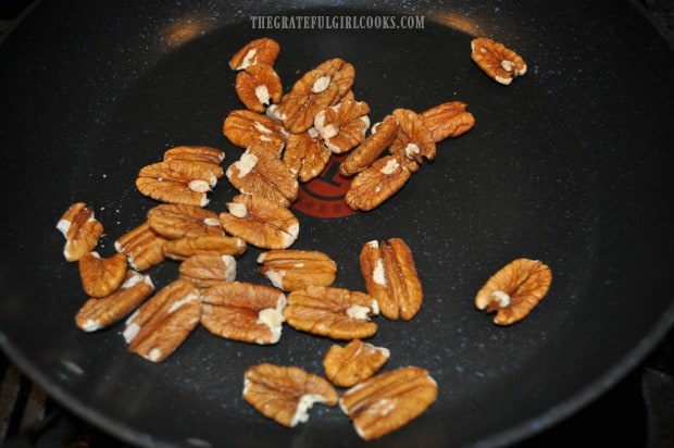 Pecans are lightly toasted in a dry skillet on medium heat.