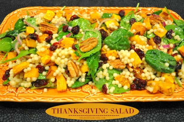 Thanksgiving Salad is a delicious dish, w/ pearl couscous, roasted butternut squash, cranberries, pecans, spinach & red onion in a citrus vinaigrette.