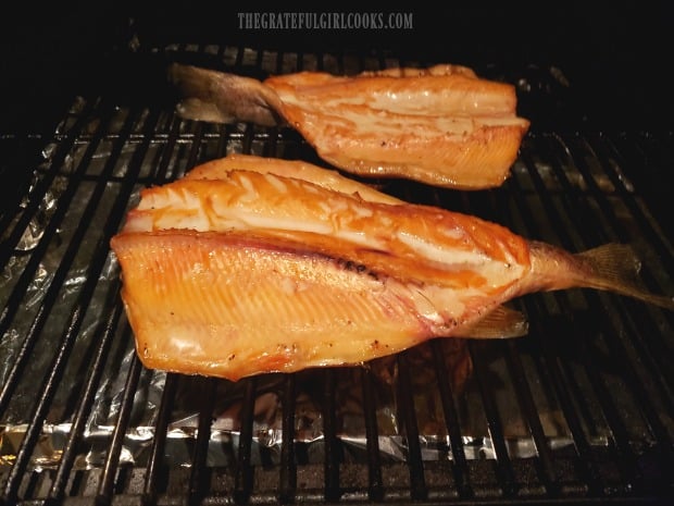 When done, Traeger smoked trout is beginning to flake and is opaque in color.