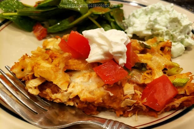 A dollop of sour cream garnishes this serving of turkey fiesta casserole.