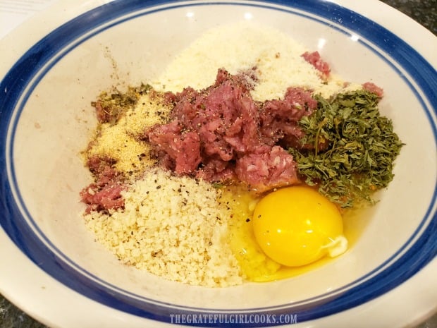 Ingredients for meatballs, ready to be combined in large bowl.