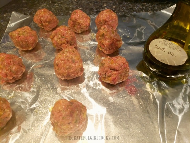 Meatballs are spritzed with cooking spray or oil before cooking.