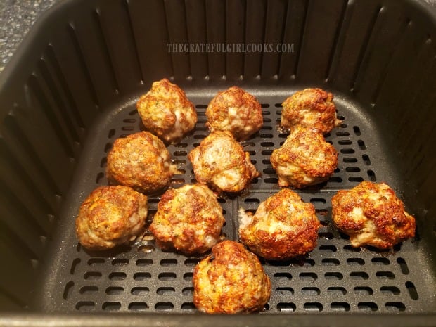 The cooked air fryer Italian meatballs are crispy and browned when done.