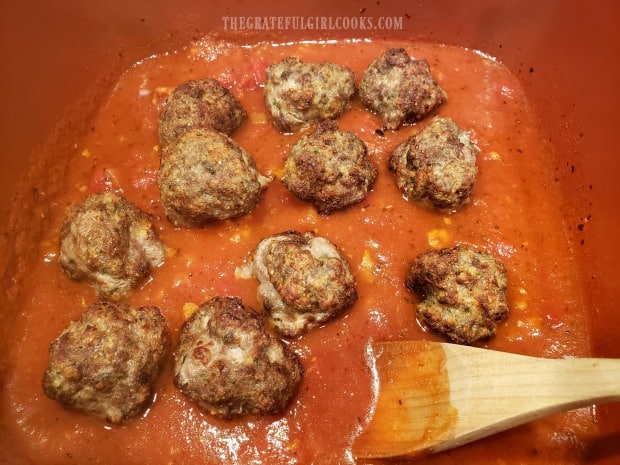Spaghetti sauce is heated, along with the air fryer cooked meatballs.