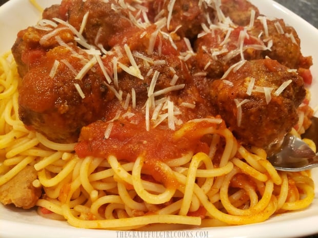 Air fryer Italian meatballs are served along with pasta and sauce!