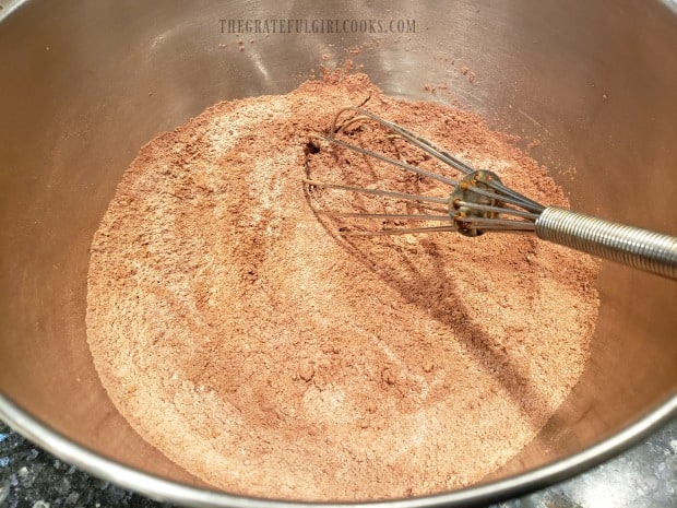 Dry ingredients for muffins are whisked together until blended.