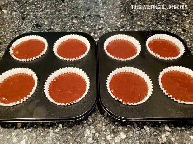 Batter is poured into paper liners in muffin tins, and then cooked in an air fryer.