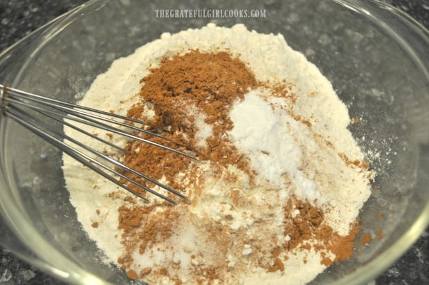 Flour, cocoa powder, baking soda and salt are combined in large bowl.