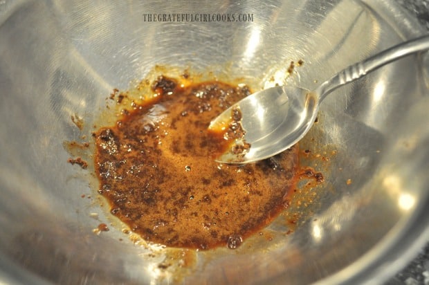 Instant coffee powder is dissolved in coffee liqueur before adding to cookie dough.