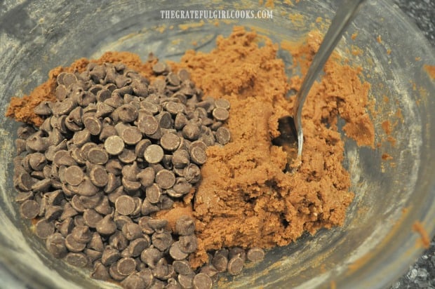 Chocolate chips are added to the cookie dough, and stirred to combine.