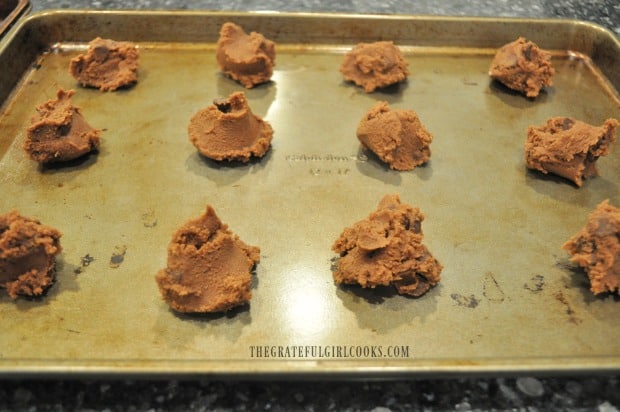 Mocha chocolate chip cookies are scooped out onto baking sheet for cooking.