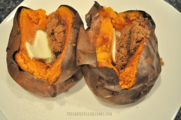 Two of the air fryer sweet potatoes, filled with butter, cinnamon and brown sugar.