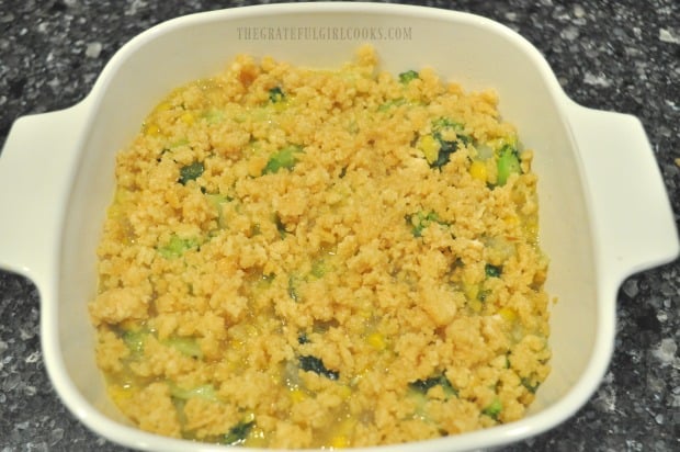 Buttery crumb topping is added to top of broccoli corn casserole before cooking.