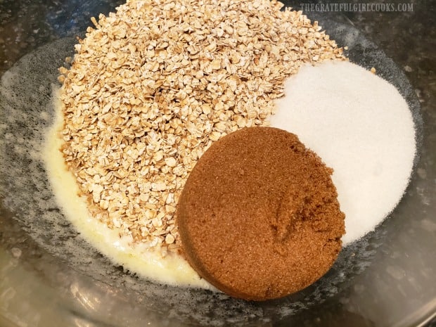 Melted butter, oats, brown and granulated sugar in mixing bowl.