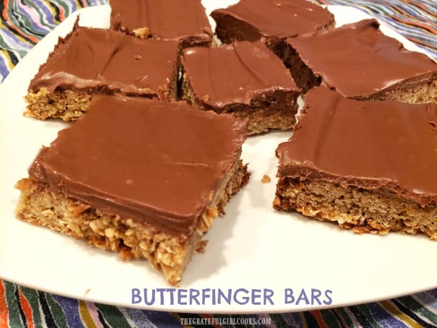 Butterfinger Bars are incredible tasting, crisp, buttery oat bars, topped with a creamy milk chocolate/peanut butter icing. This easy recipe makes 24!