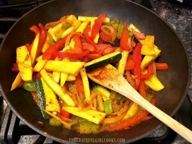 Veggies are cooked to add to the chicken veggie TexMex skillet.