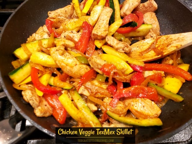 Southwest flavors shine in this deliciously seasoned, low-calorie Chicken Veggie TexMex Skillet, with zucchini, onion, yellow squash, & bell peppers!