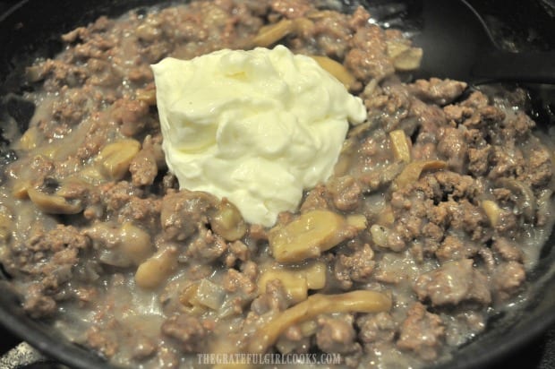 Sour cream is added to the ground beef stroganoff.