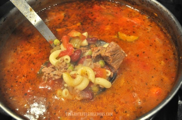 The macaroni noodles cook fully in the hot minestrone soup.