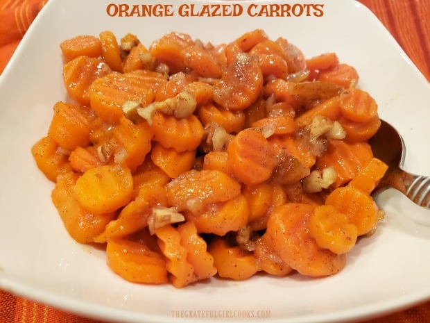 Orange Glazed Carrots are a simple but delicious side dish, featuring buttery, marmalade glazed carrots, pecans, fresh ginger and cinnamon!