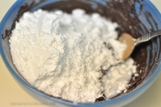 Powdered sugar and a small amount of milk are mixed into the best brownie frosting.