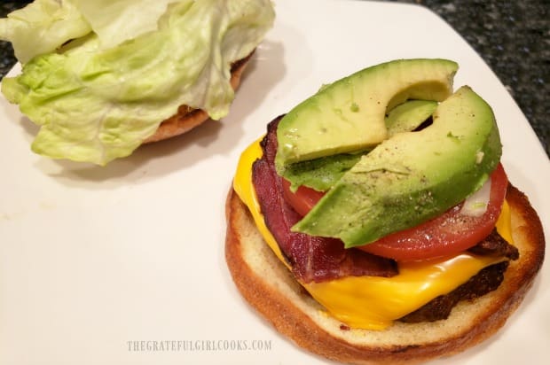 Air fryer bacon cheeseburger is assembled before eating.