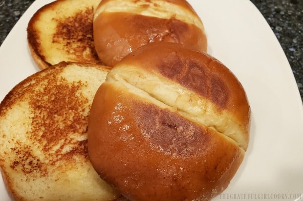 Hamburger buns, after being lightly toasted with butter in a skillet 